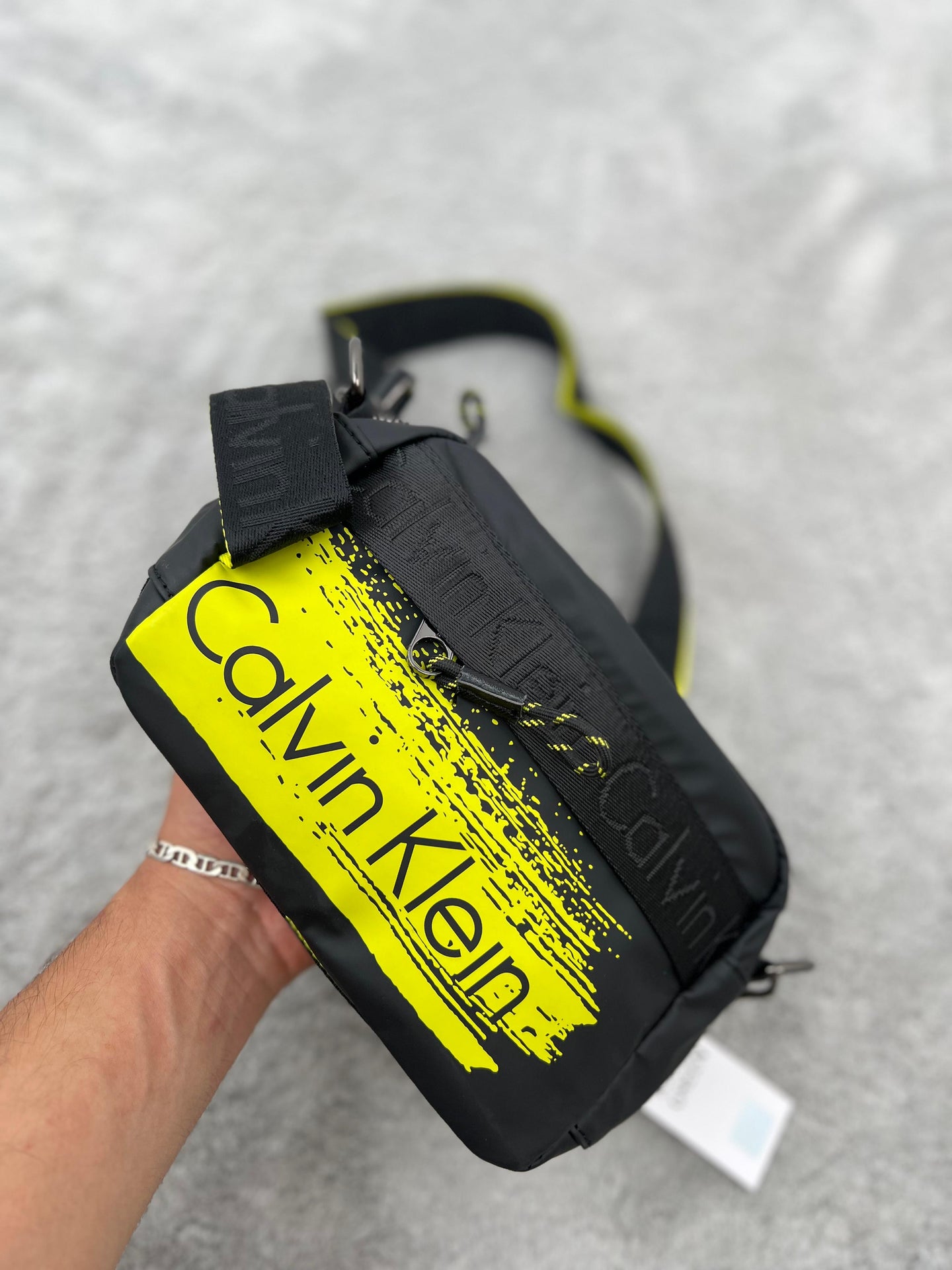 BANDOLERA -  CALVIN KLEIN