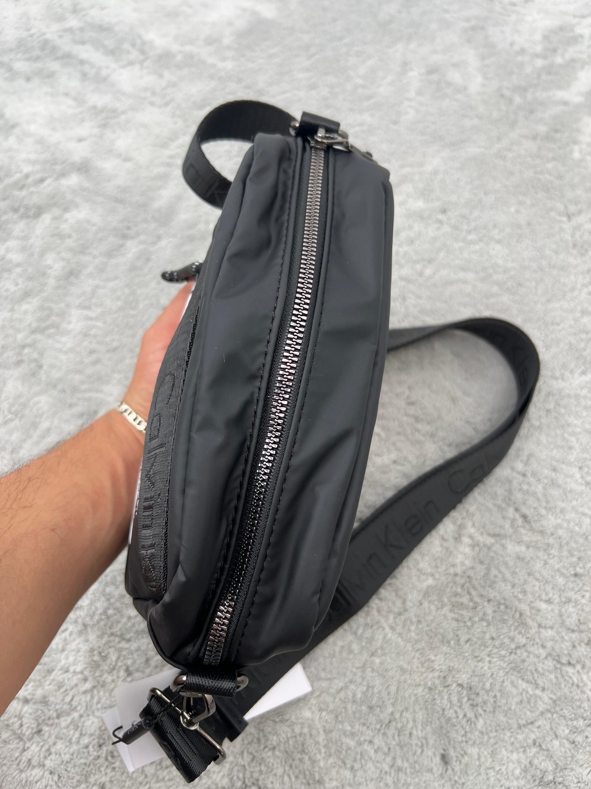 BANDOLERA -  CALVIN KLEIN
