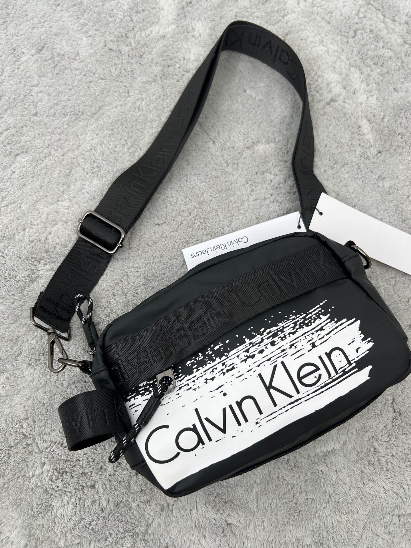 BANDOLERA -  CALVIN KLEIN