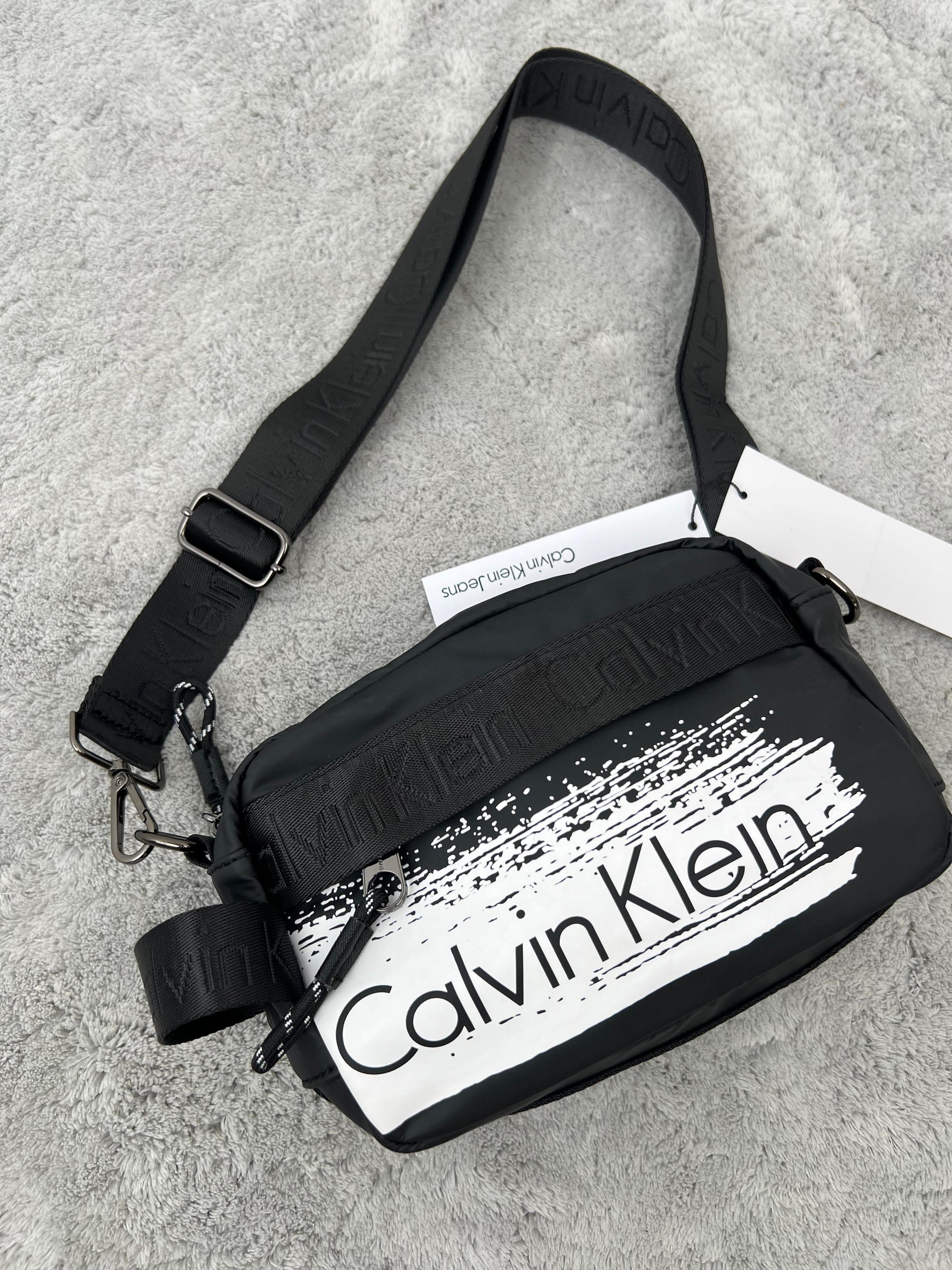 BANDOLERA -  CALVIN KLEIN