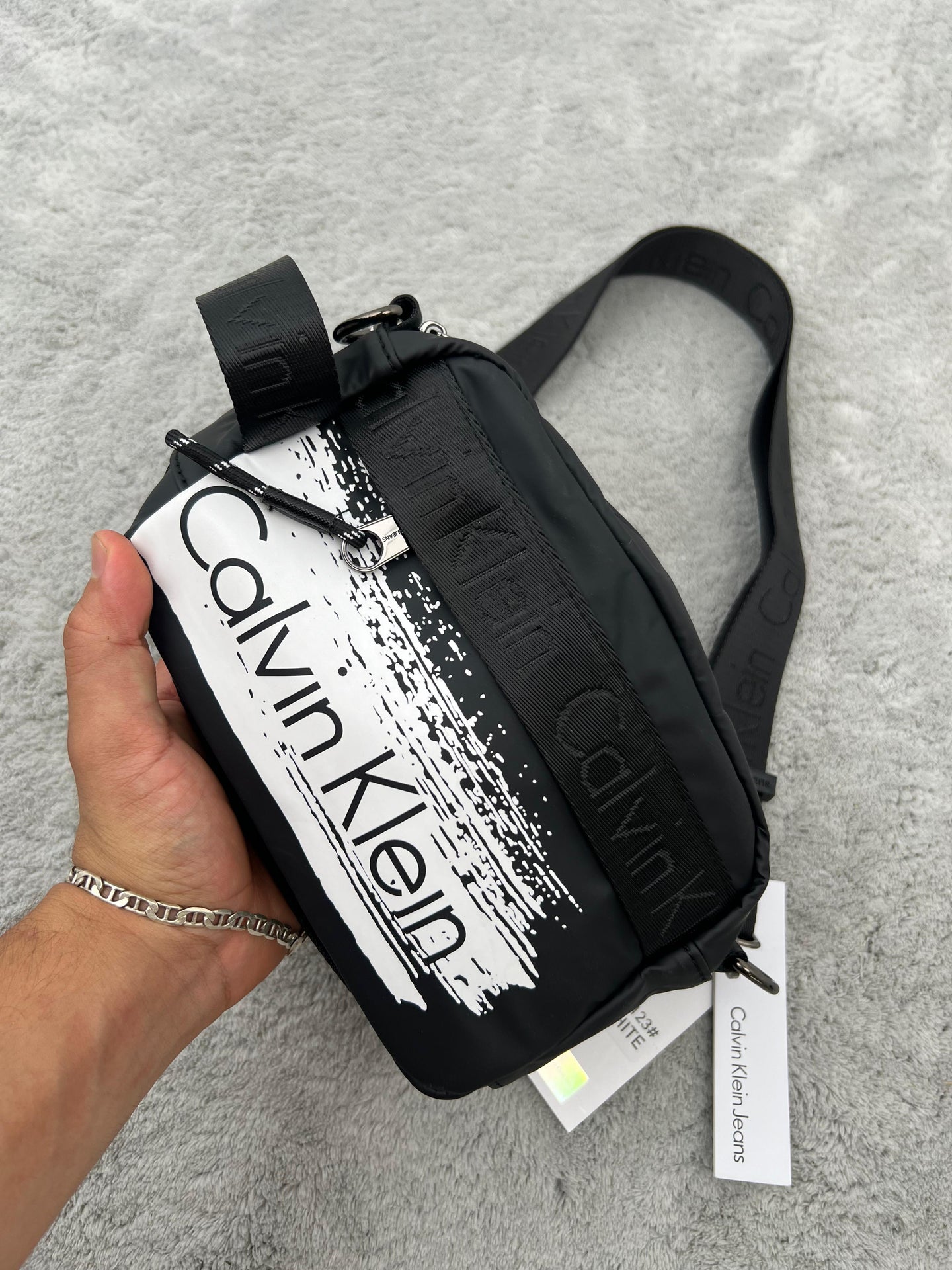 BANDOLERA -  CALVIN KLEIN