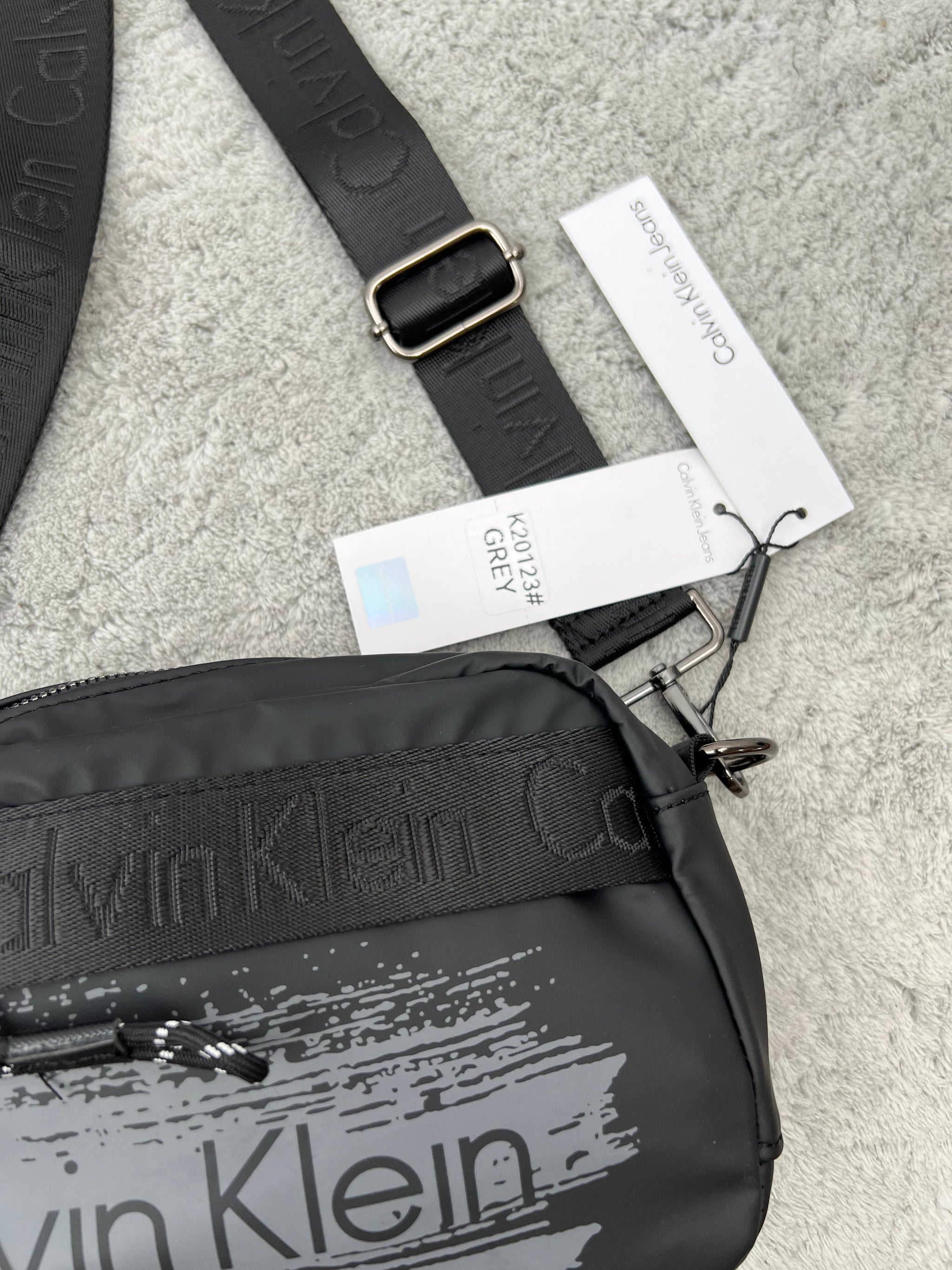 BANDOLERA -  CALVIN KLEIN